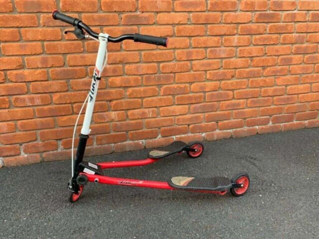 red and white wiggle scooter